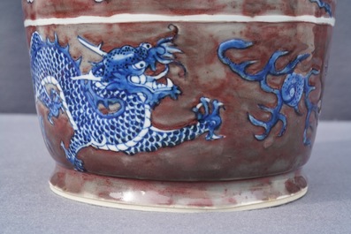 A rare Chinese blue, white and underglaze red rouleau vase, Kangxi